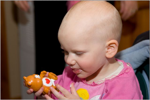 Licking the icing off.