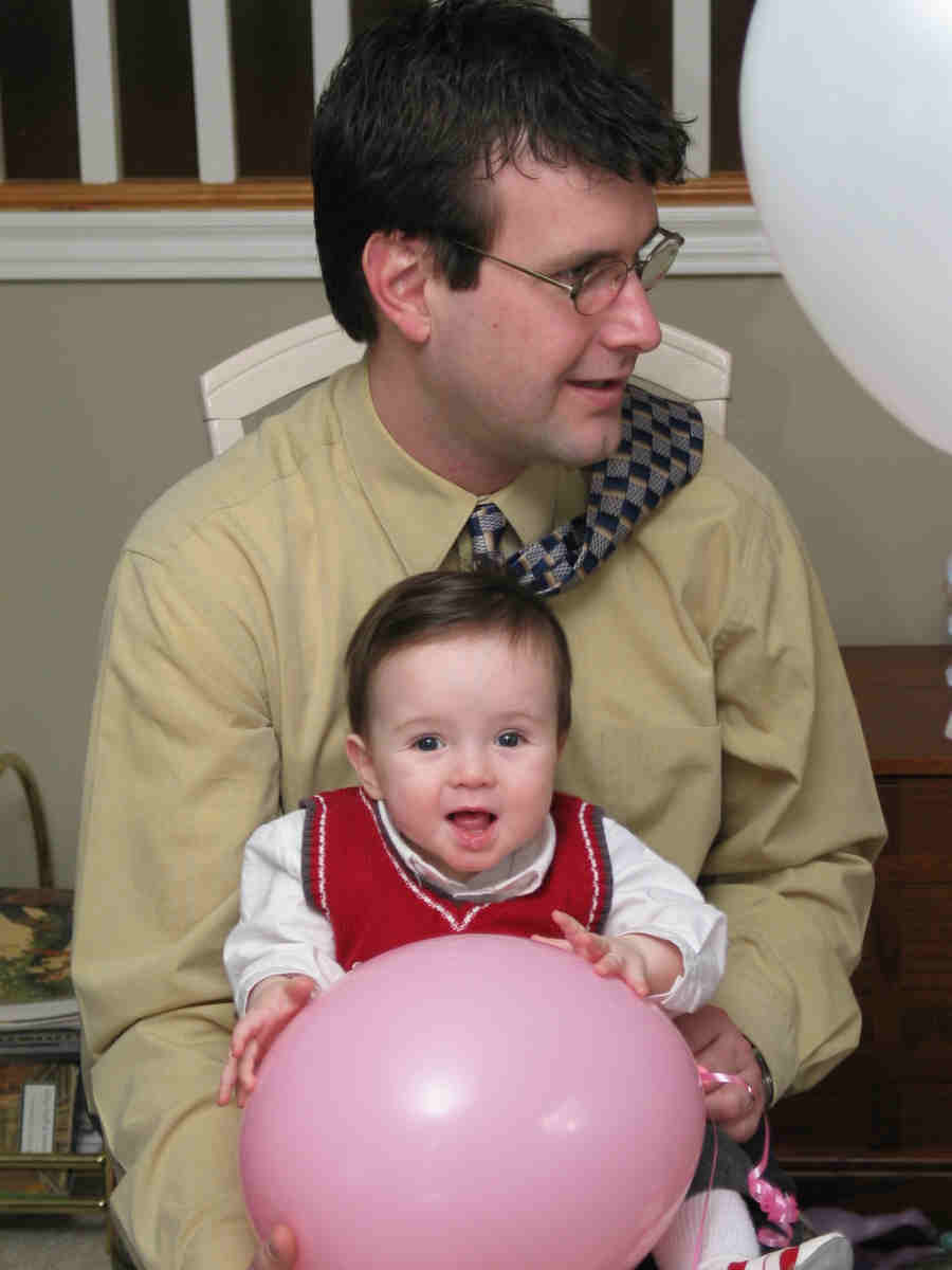 Here's Olivia's Uncle Jamie holding little Trevor- Trevor's such a cutie. Jamie? Maybe.